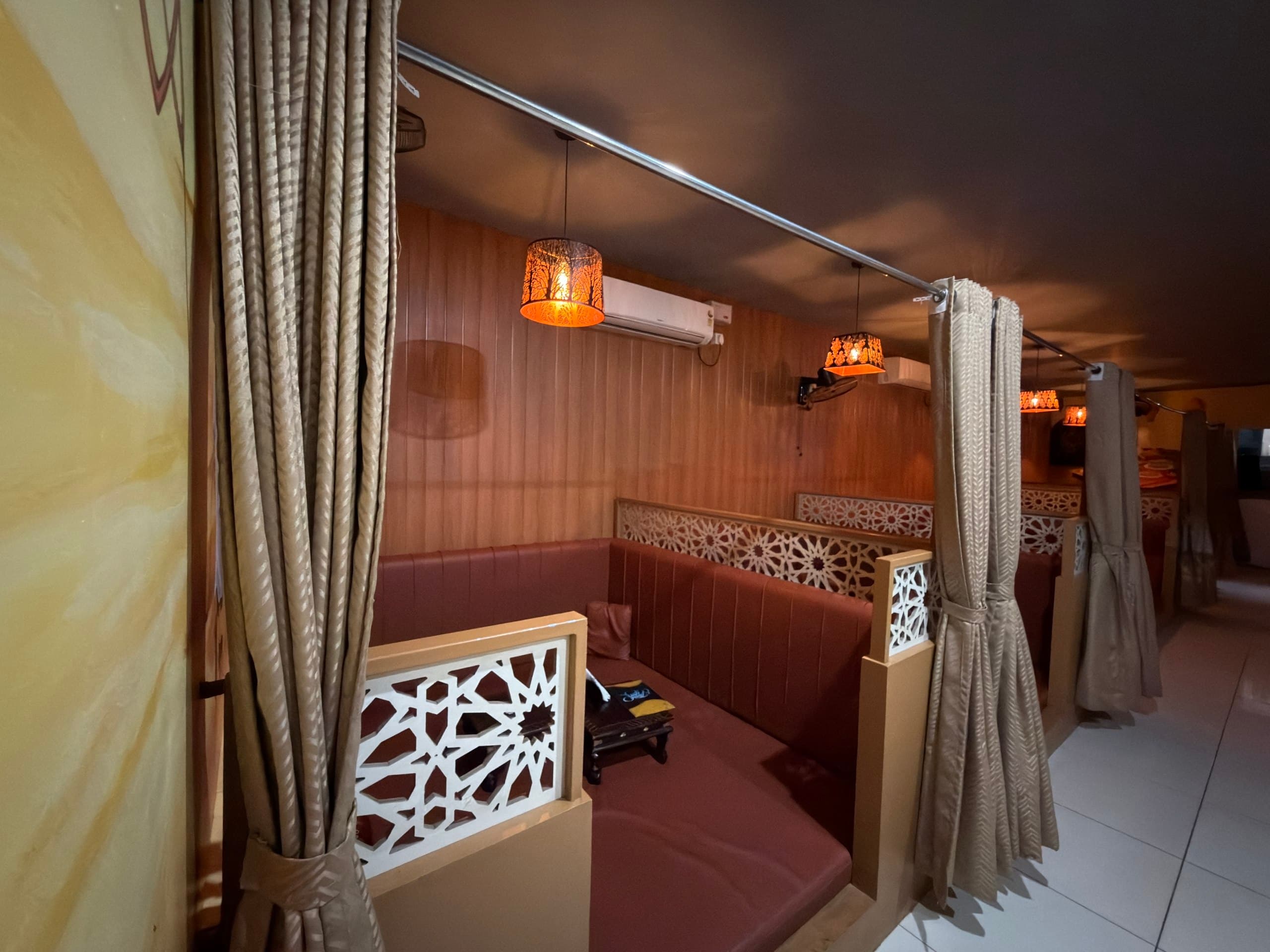 Private curtained seating inside Habibi Arabian Mandi