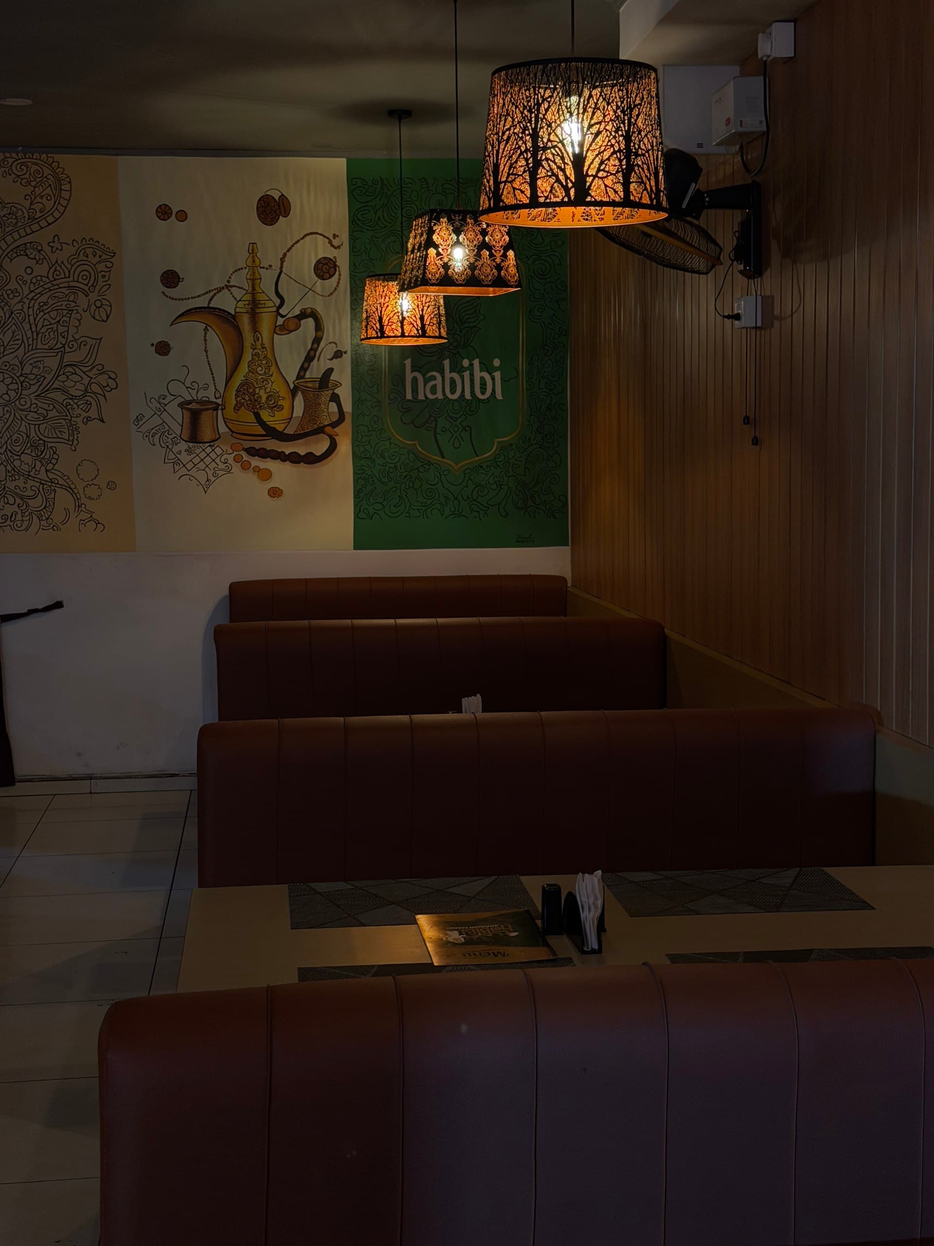 Warm lounge seating inside Habibi Arabian Mandi